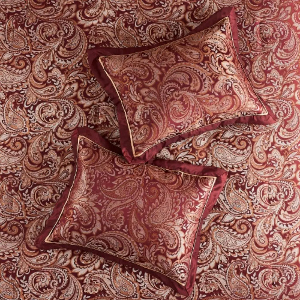 Decorative euro shams and accent pillows with matching paisley jacquard design for complete bedding set