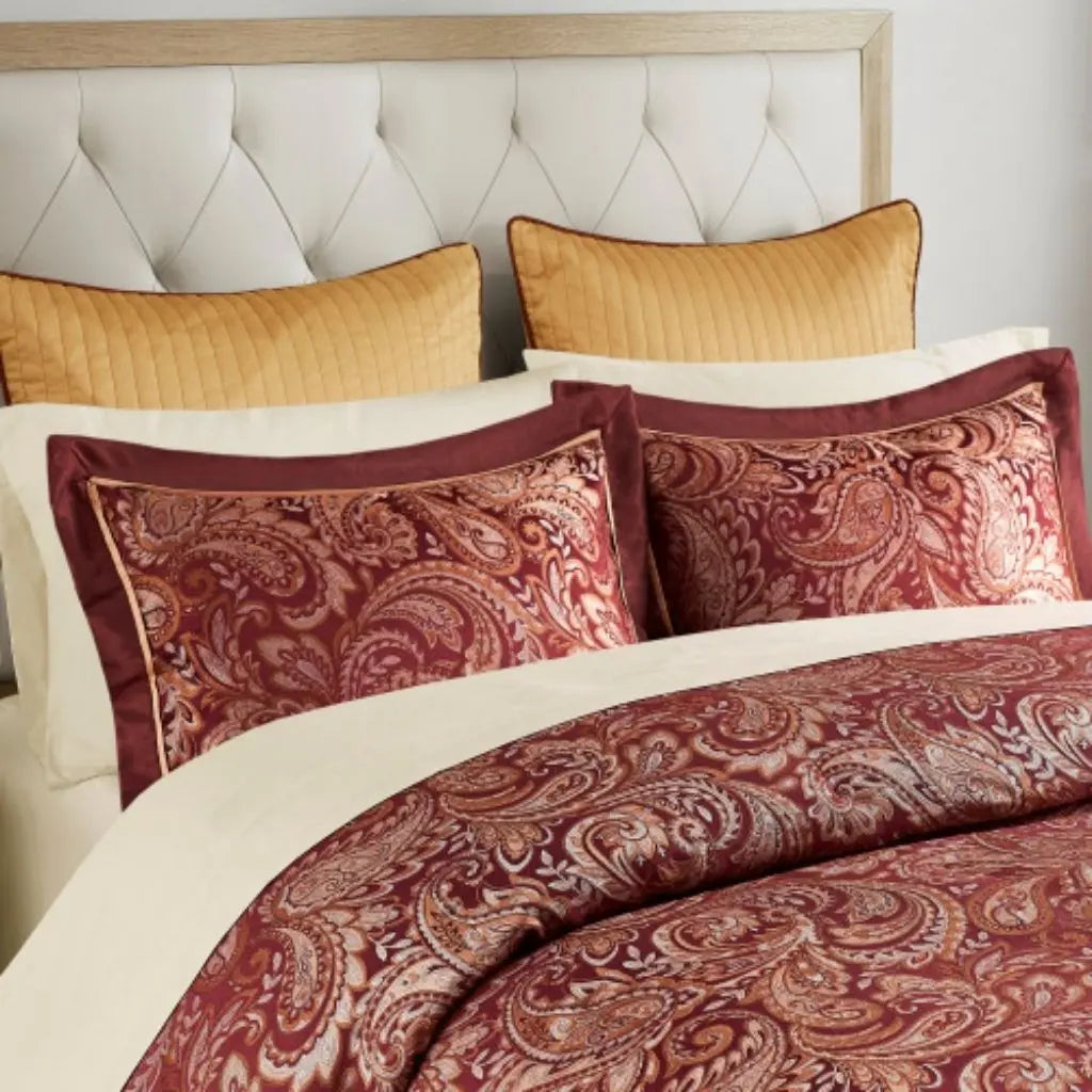 Complete paisley bedding ensemble with jacquard comforter and matching pillows creating coordinated bedroom decor