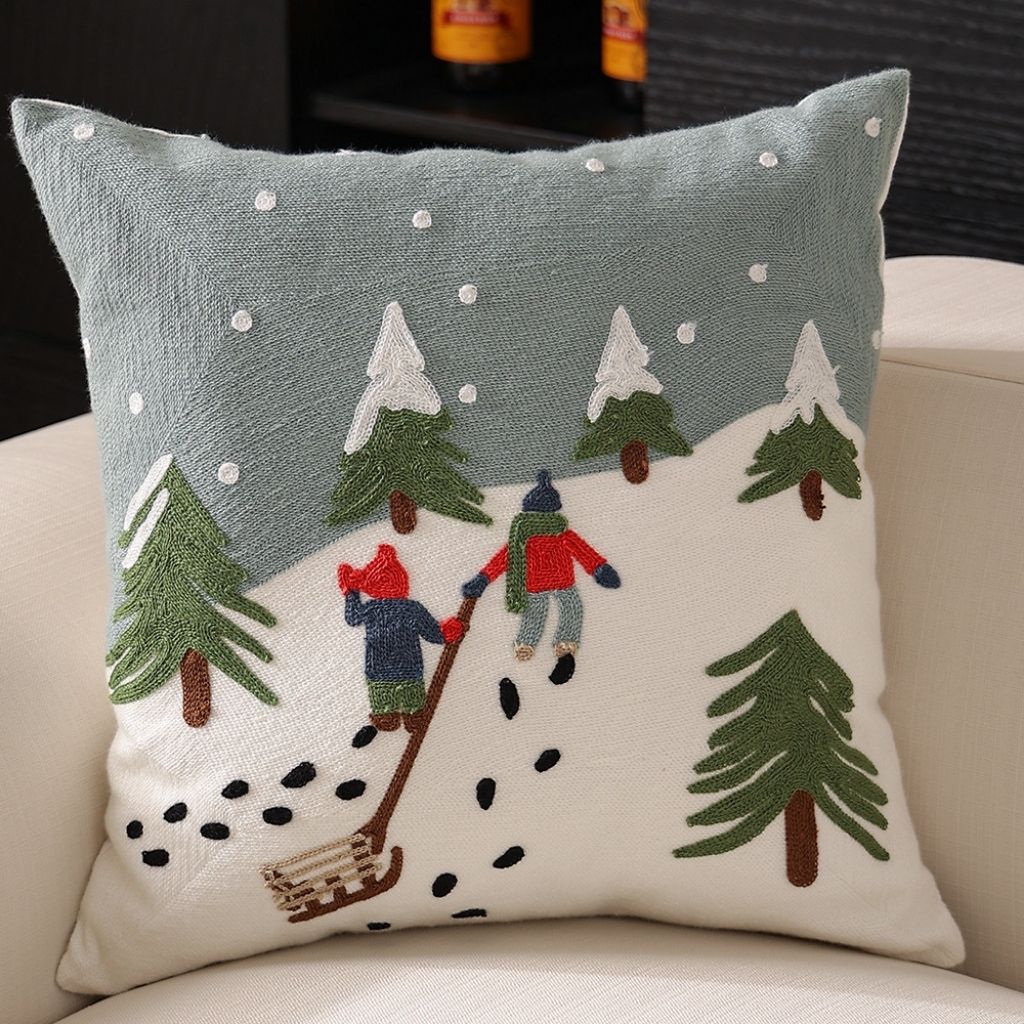 Red cushion cover with embroidered Christmas gift box and snowflake pattern