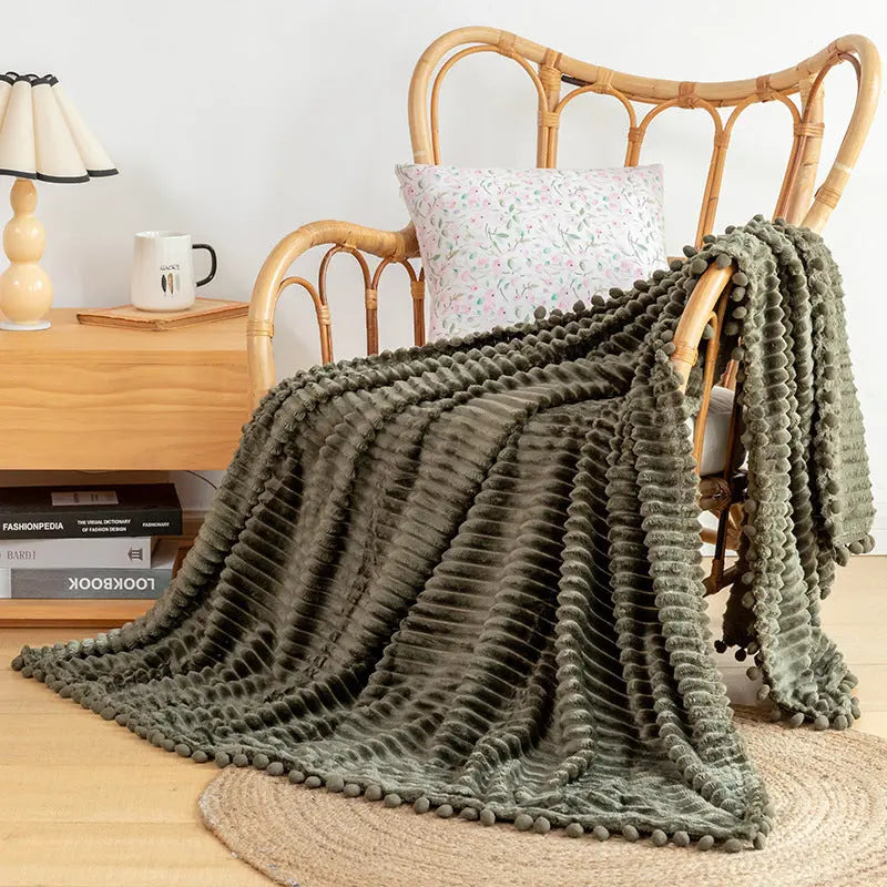 Velvet fringe throw in polyester flannel perfect for reading nook and modern decor