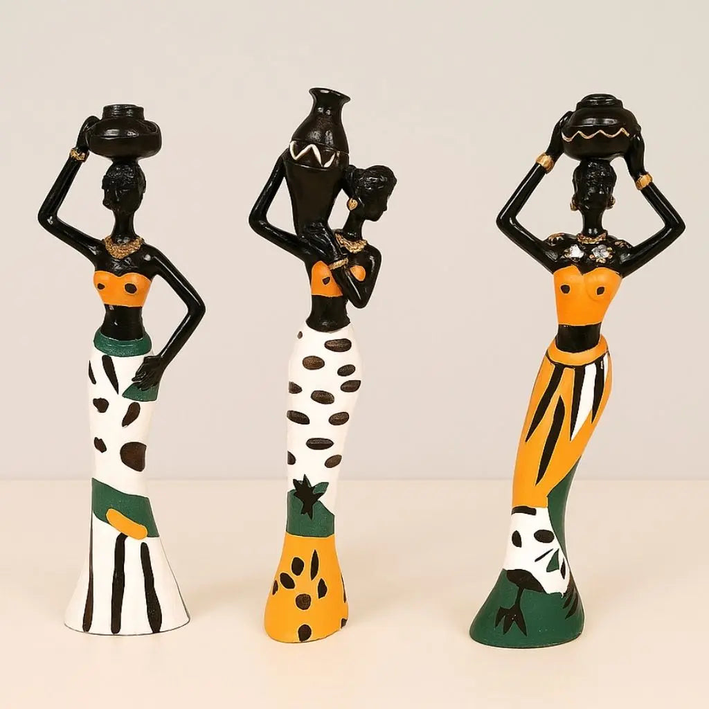 Handcrafted African figurines set featuring elegant women in vibrant traditional attire for cultural home decor