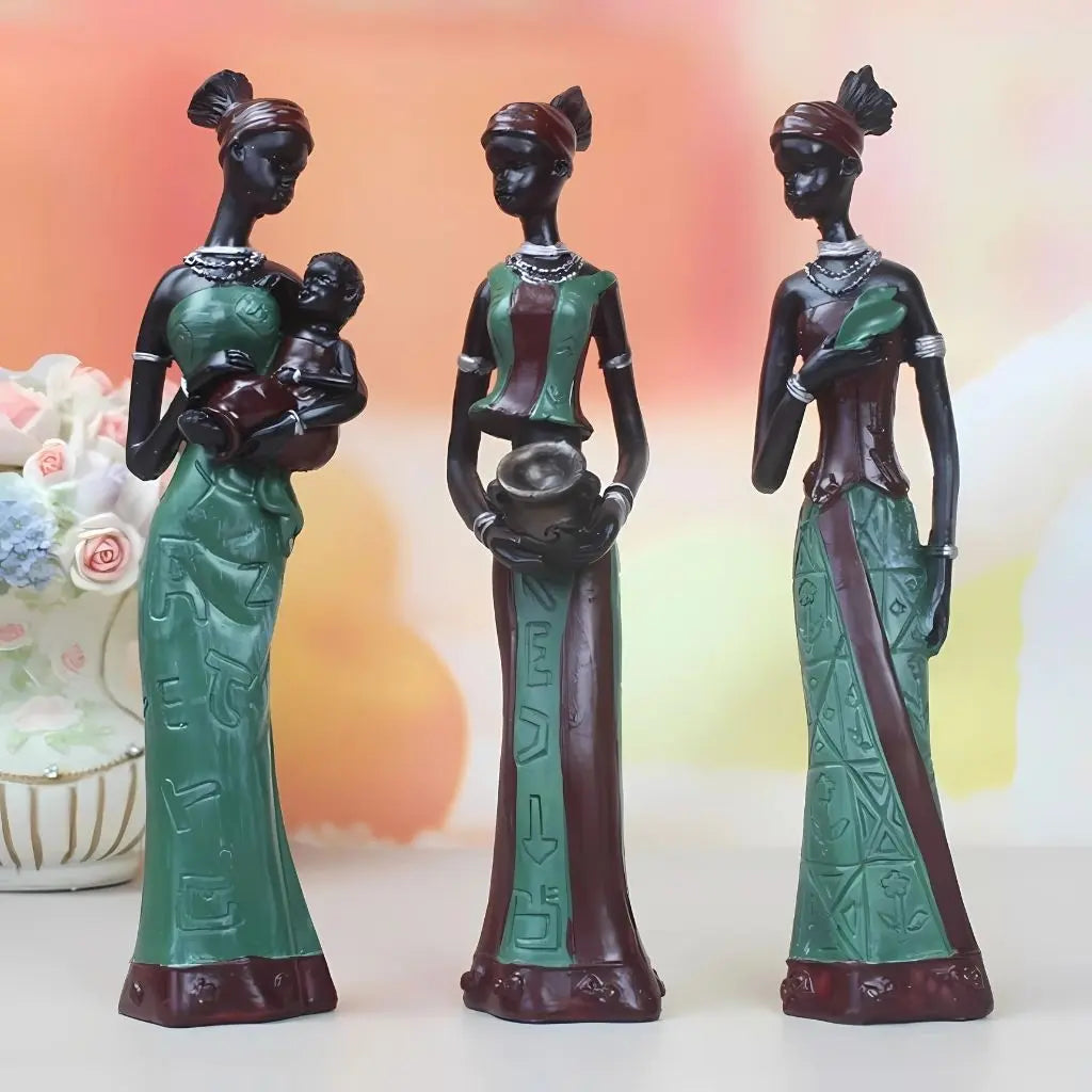 Ethnic home accessories featuring handcrafted African figurines with intricate cultural patterns and designs