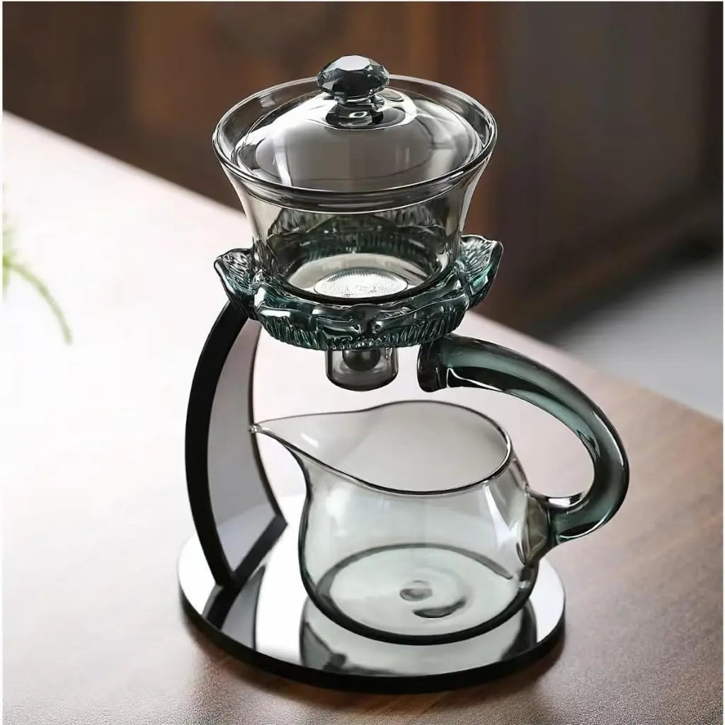 Glass tea infuser demonstrating loose leaf brewing process with elegant lotus-inspired design elements