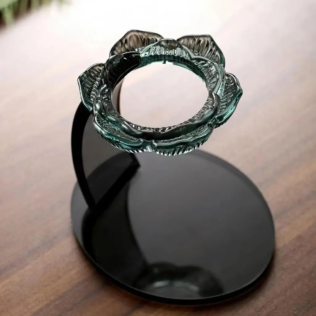 Functional glass tea strainer with lotus design, featuring easy-pour spout and comfortable brewing handle