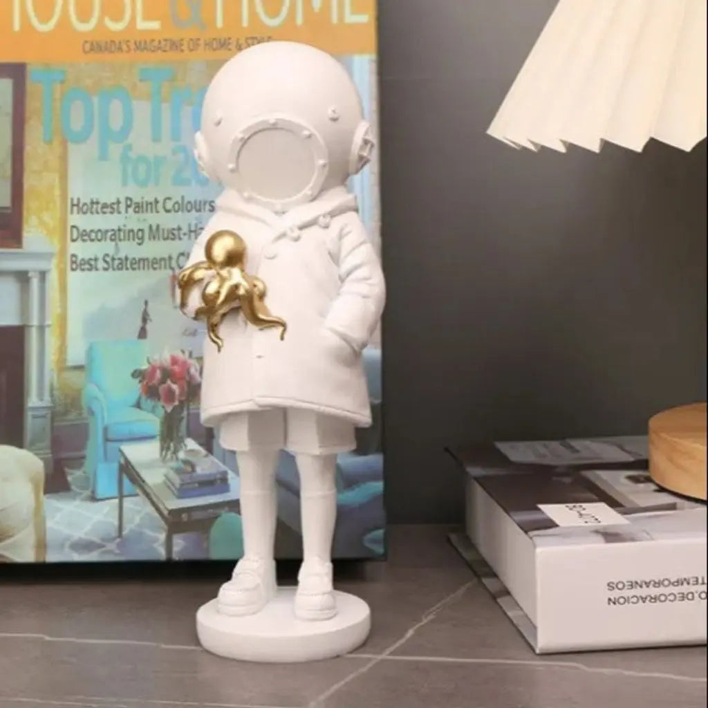 Astronaut diver figurine featuring golden octopus handcrafted resin statue for modern interior decor