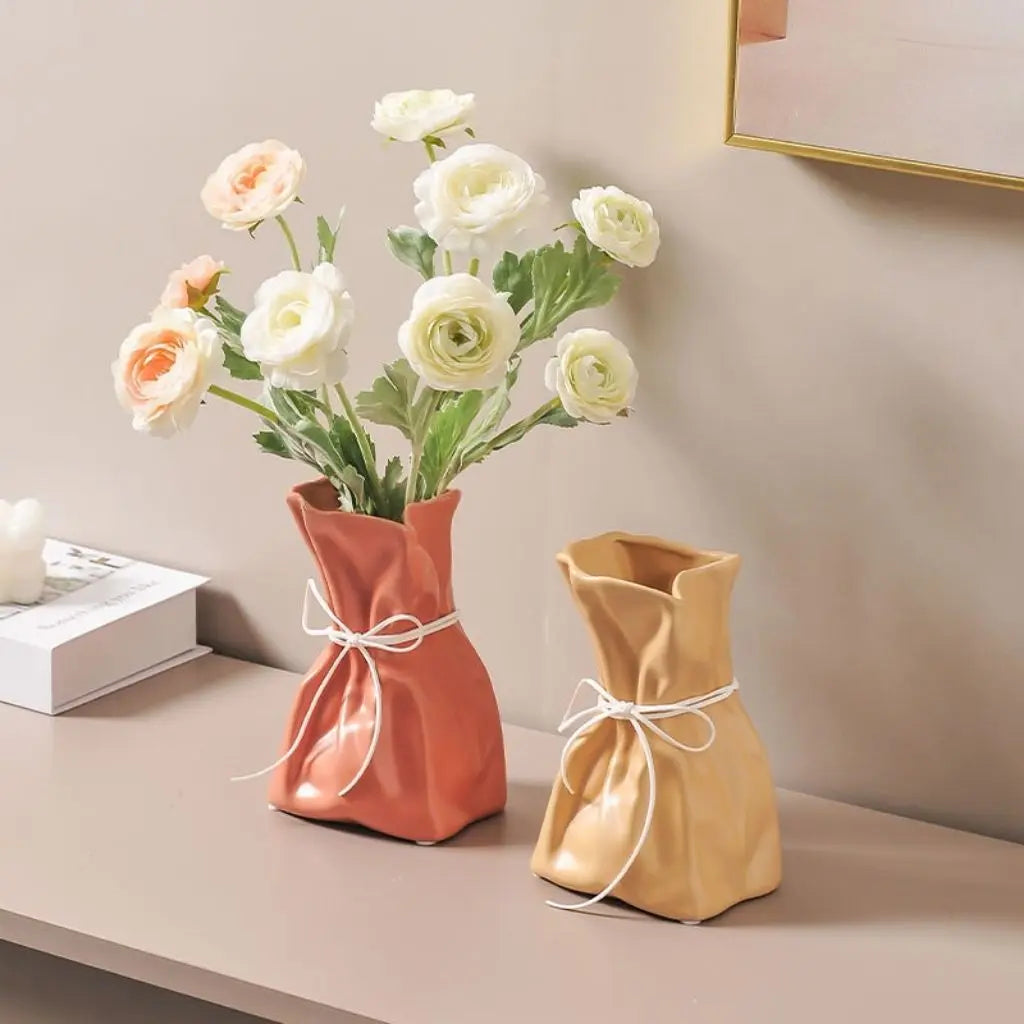 Artisan crafted ceramic flower holder with rope drawstring detail for elegant home accents