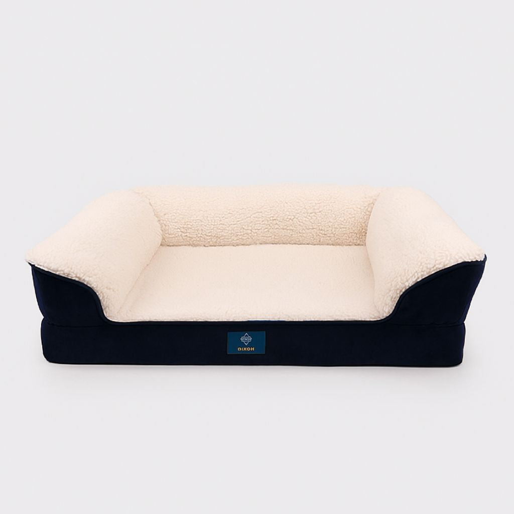 Orthopedic dog bed with fleece upholstery and raised bolstered sides for joint support