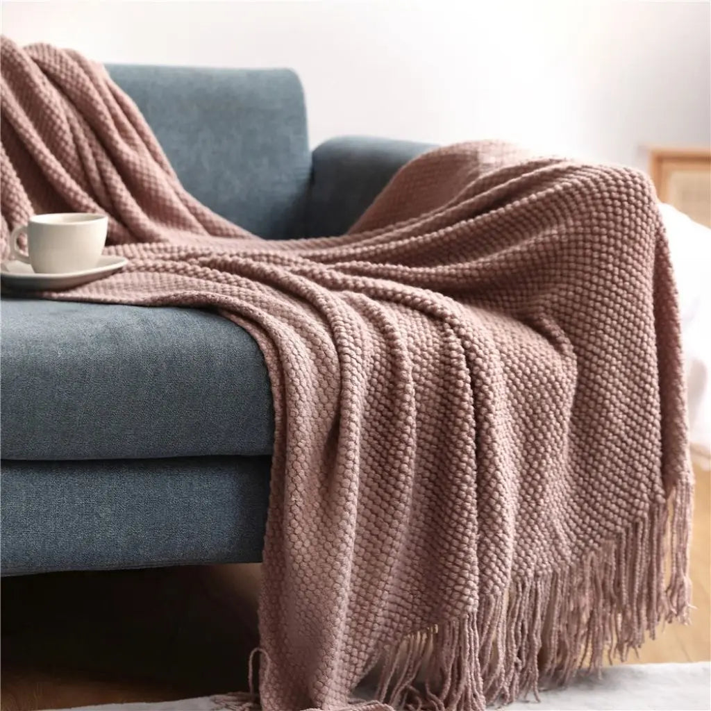 Decorative throw blanket in soft acrylic with knitted pattern available in multiple sizes