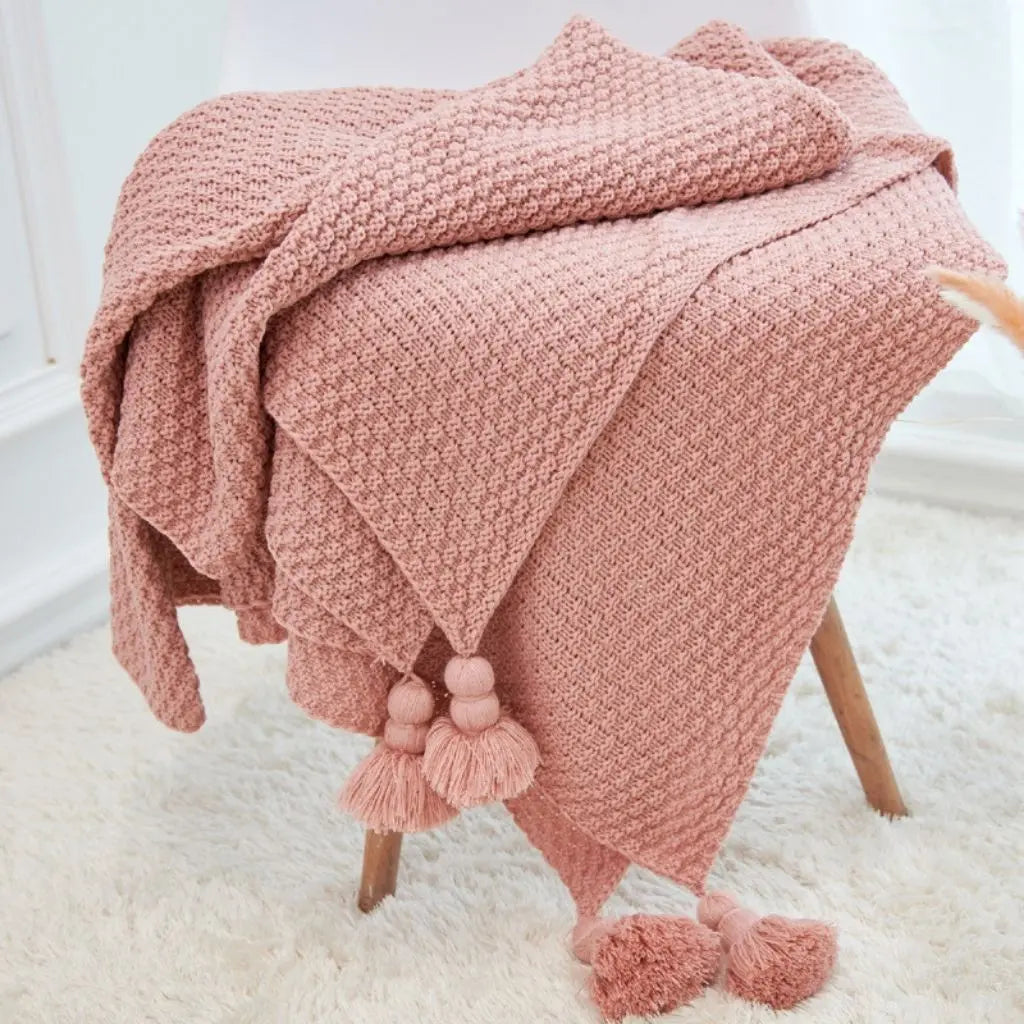 Modern lightweight blanket featuring pineapple tassel pattern in neutral color