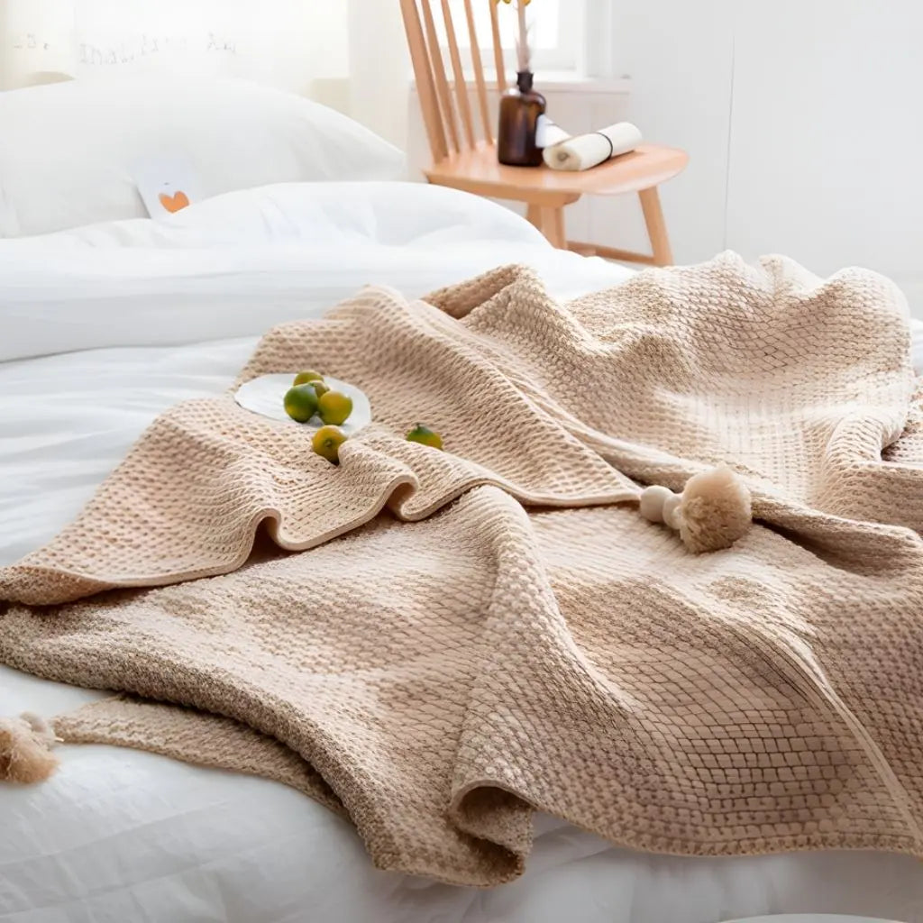 Woven blanket with tassel trim perfect for bedroom and reading corner use