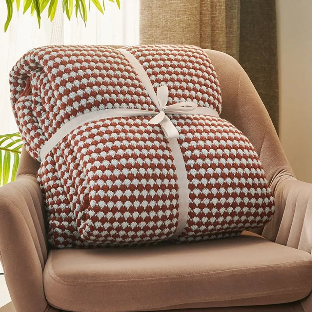 Jacquard woven blanket with two-tone pattern used as sofa cover for modern comfort