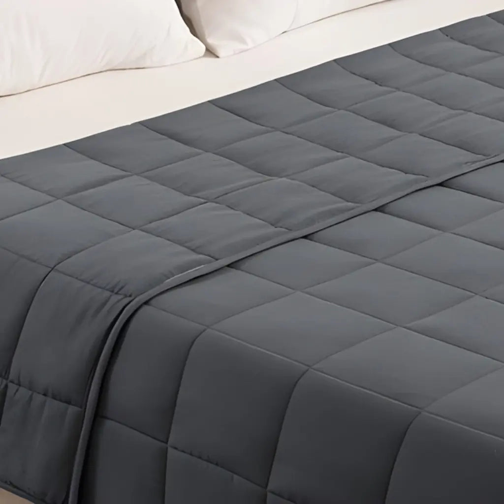 Natural cotton blanket with plain design and neutral color for versatile bedroom decor and comfort