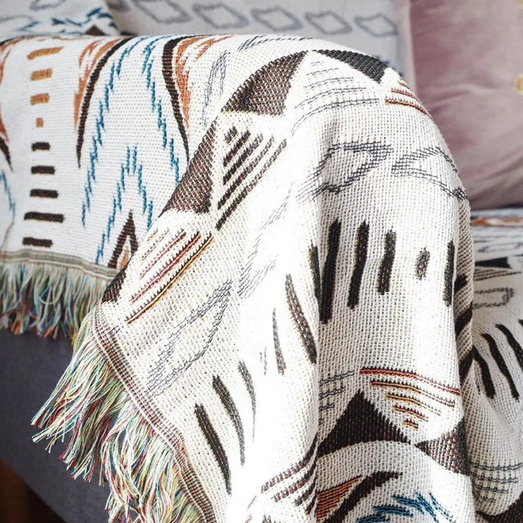 Abstract geometric pattern sofa throw in cotton blend fabric with decorative fringe edges