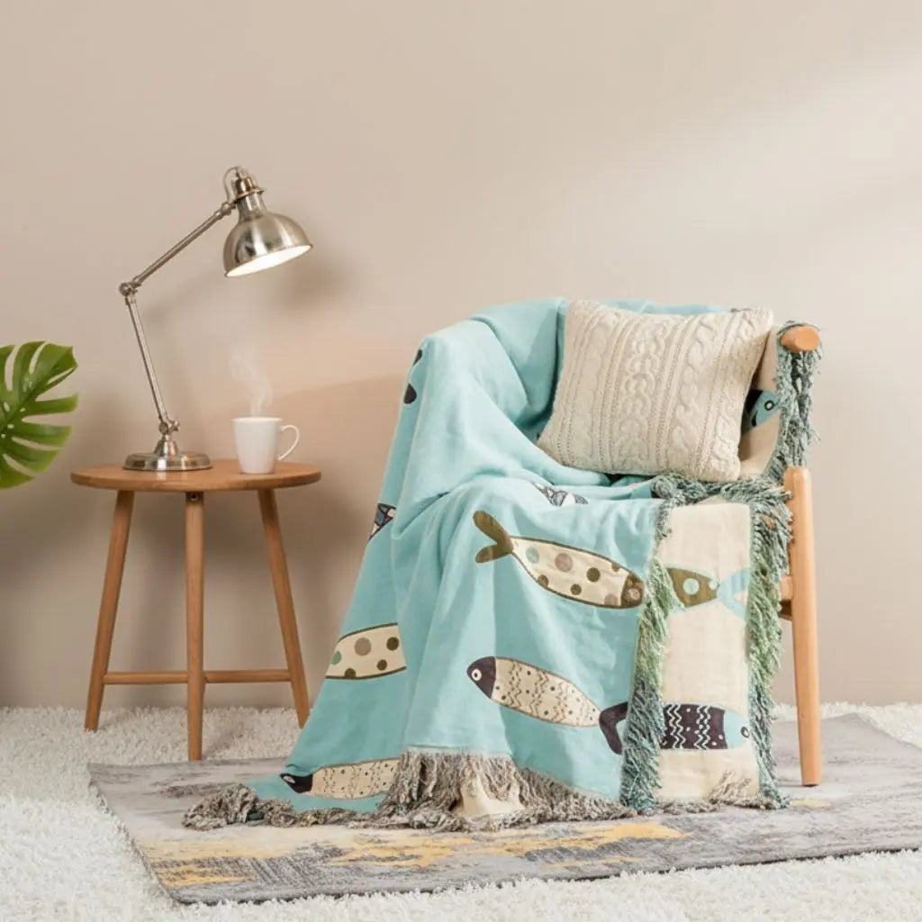 Fish pattern throw blanket made from breathable cotton gauze with decorative fringe