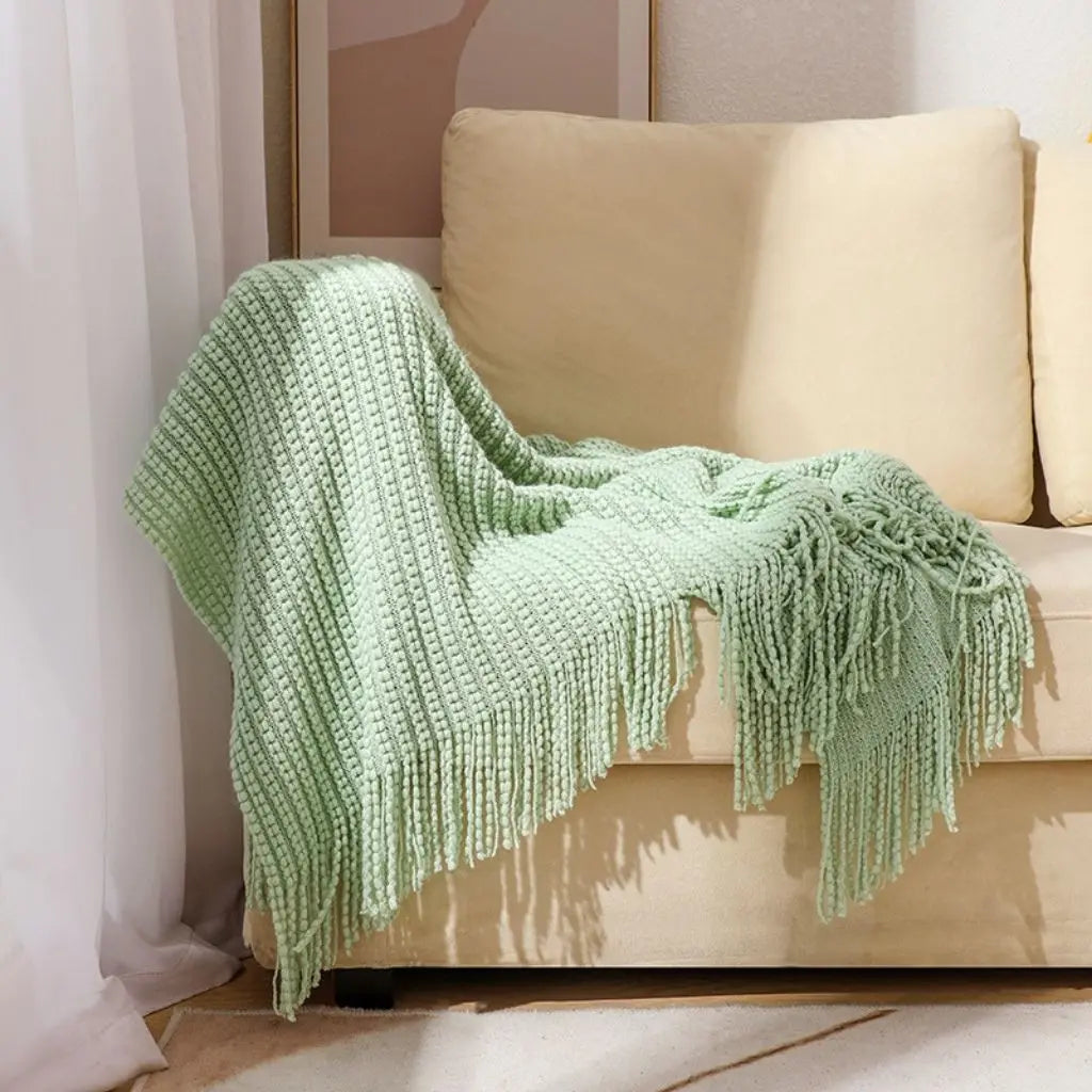 Chenille bed throw with fringed edges perfect for layering and bedroom accent styling