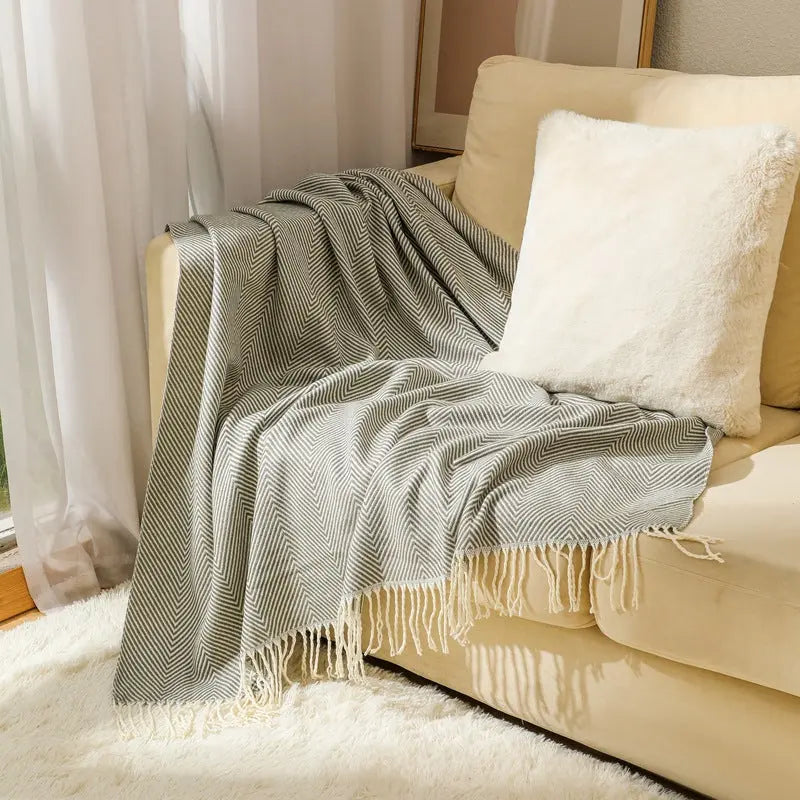 Durable acrylic herringbone throw blanket with subtle stripe pattern and fringe finish