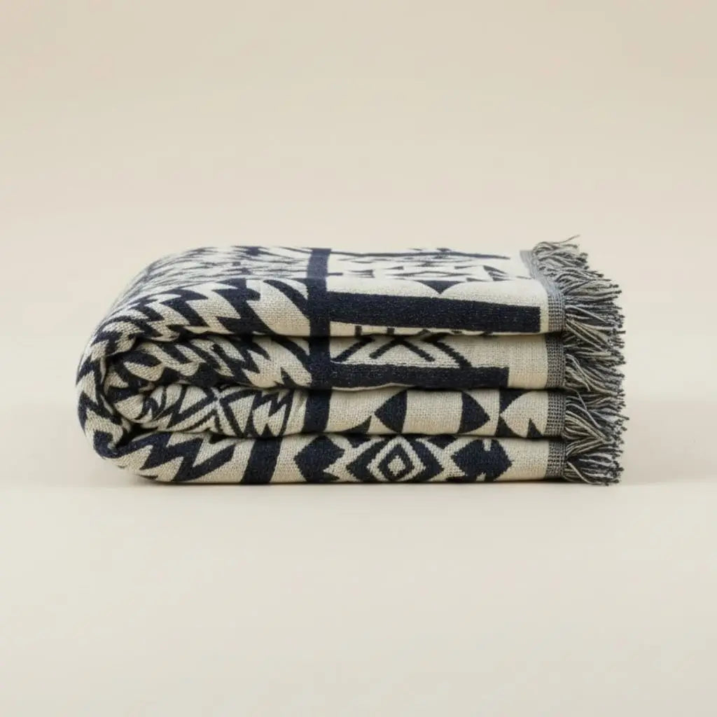 Geometric cotton throw blanket with breathable woven fabric for year-round home use