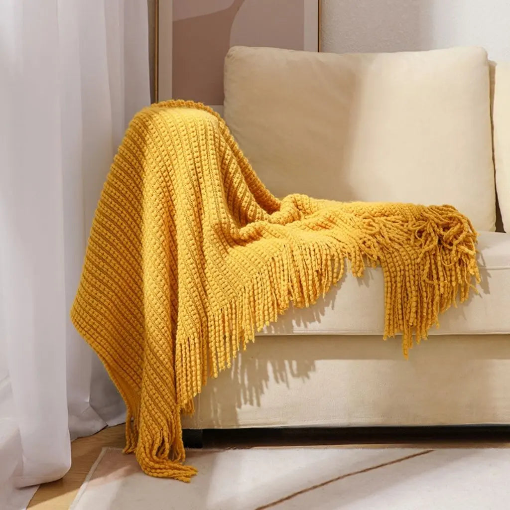 Relaxed chenille throw blanket with casual fringe design for reading nooks and nap time