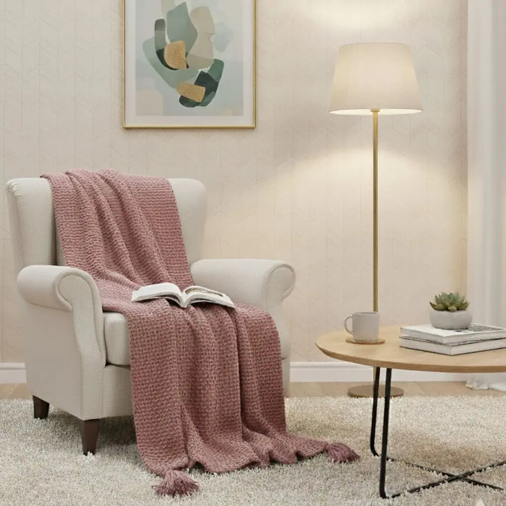 Beige knit throw blanket with fringe for cozy home decor