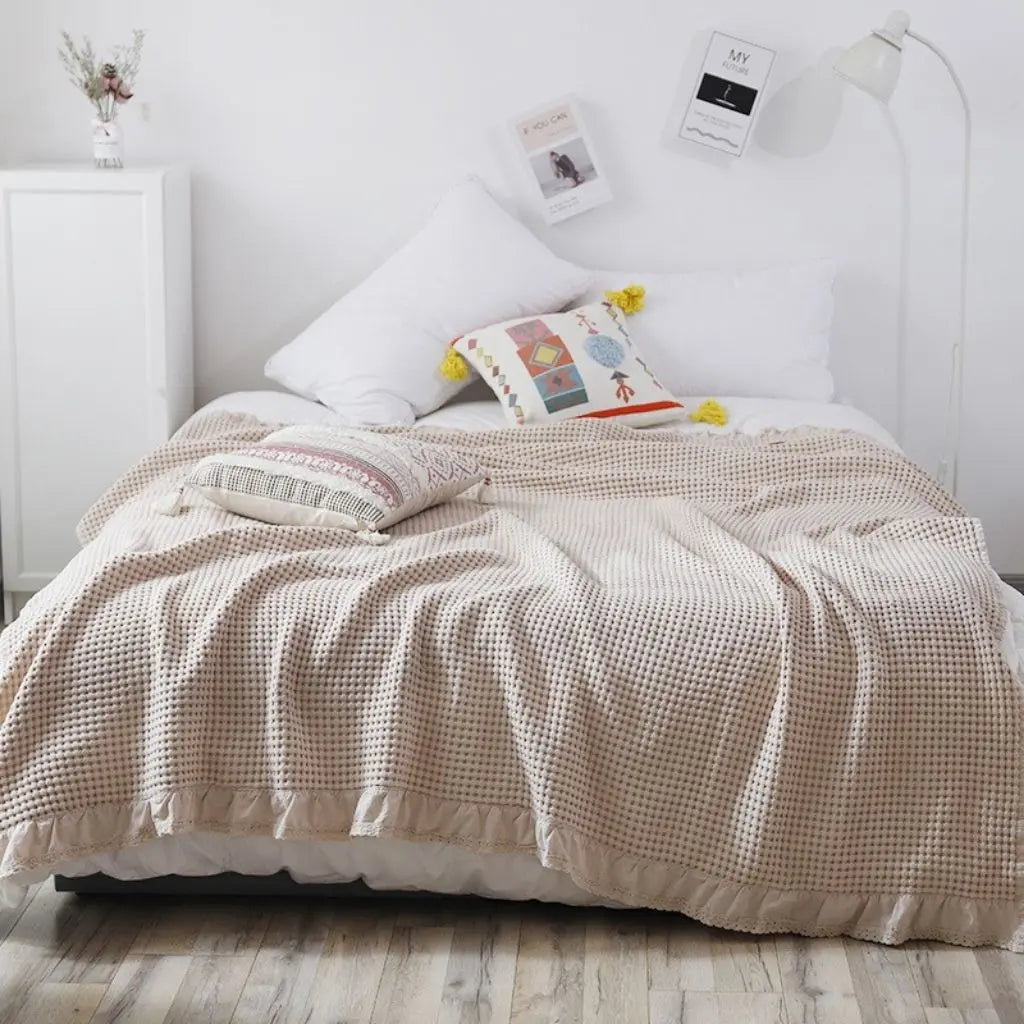 Soft waffle cotton quilt featuring lace detail for cozy home textiles