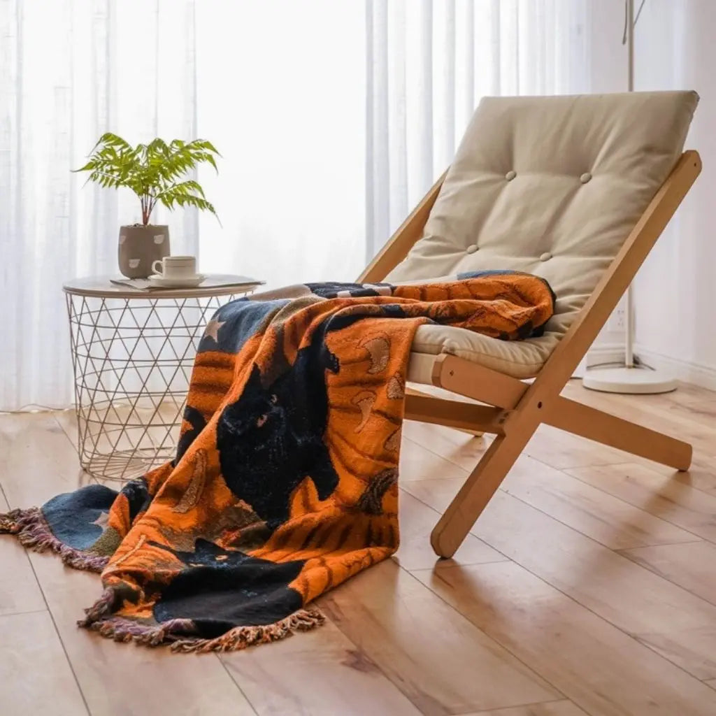 Halloween throw blanket with pumpkin motifs and tassels cotton polyester blend for autumn home decor