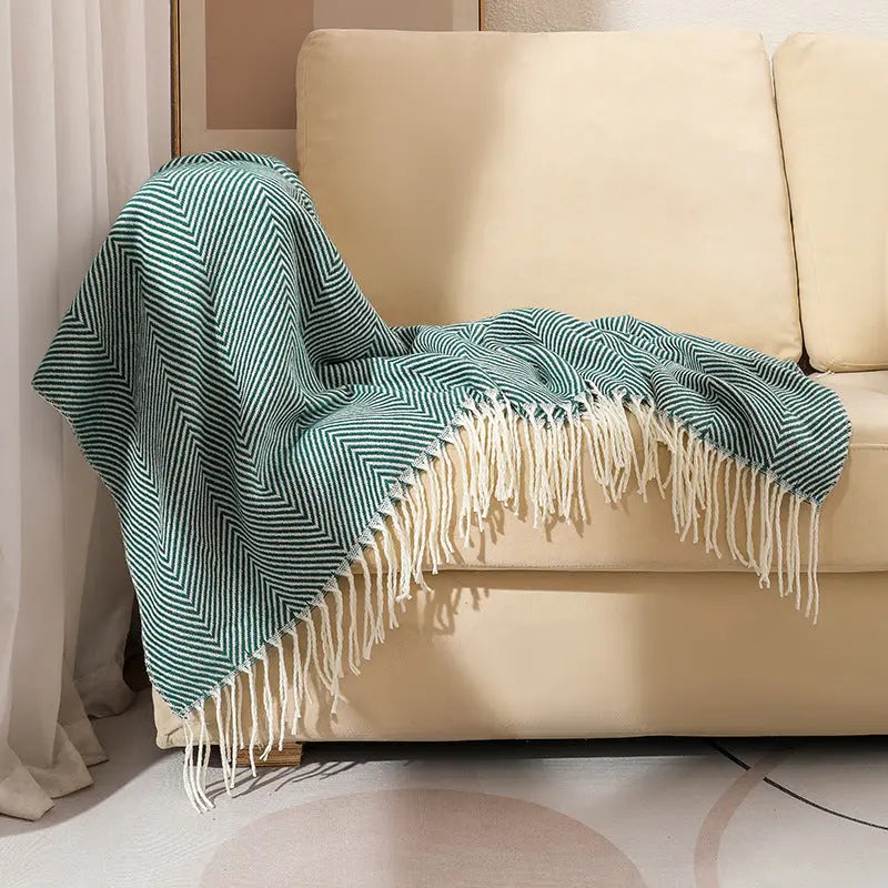 Acrylic herringbone throw with soft fringe detailing showing textured weave pattern