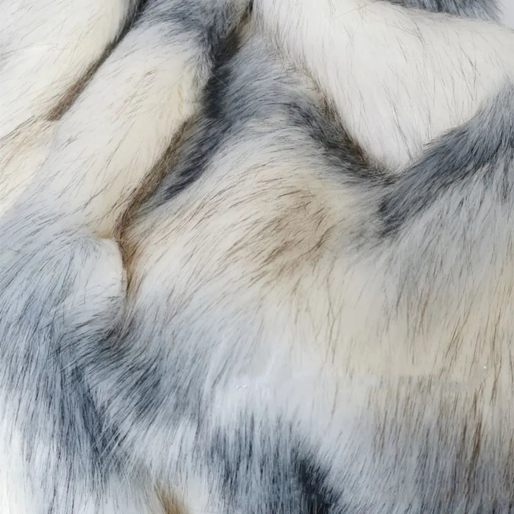 Soft faux fur throw blanket folded to show texture and quality for bedroom comfort