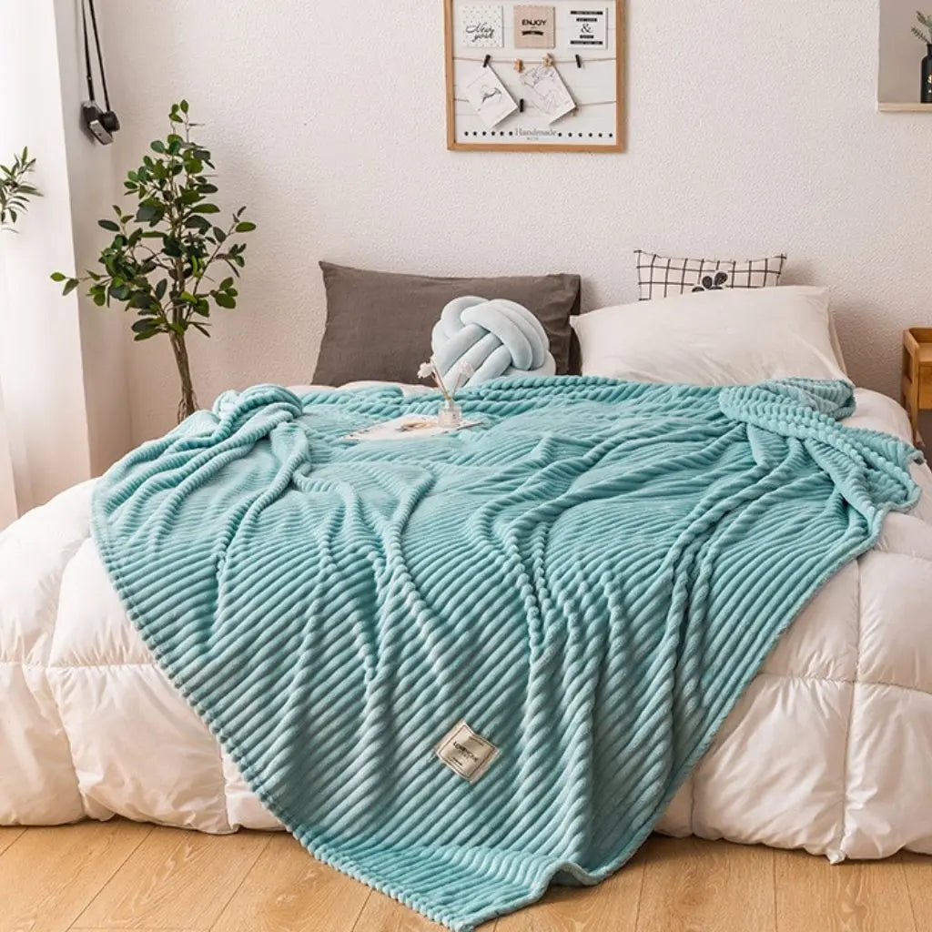 Minimalist fleece throw blanket with plain design perfect for bedroom and living room décor