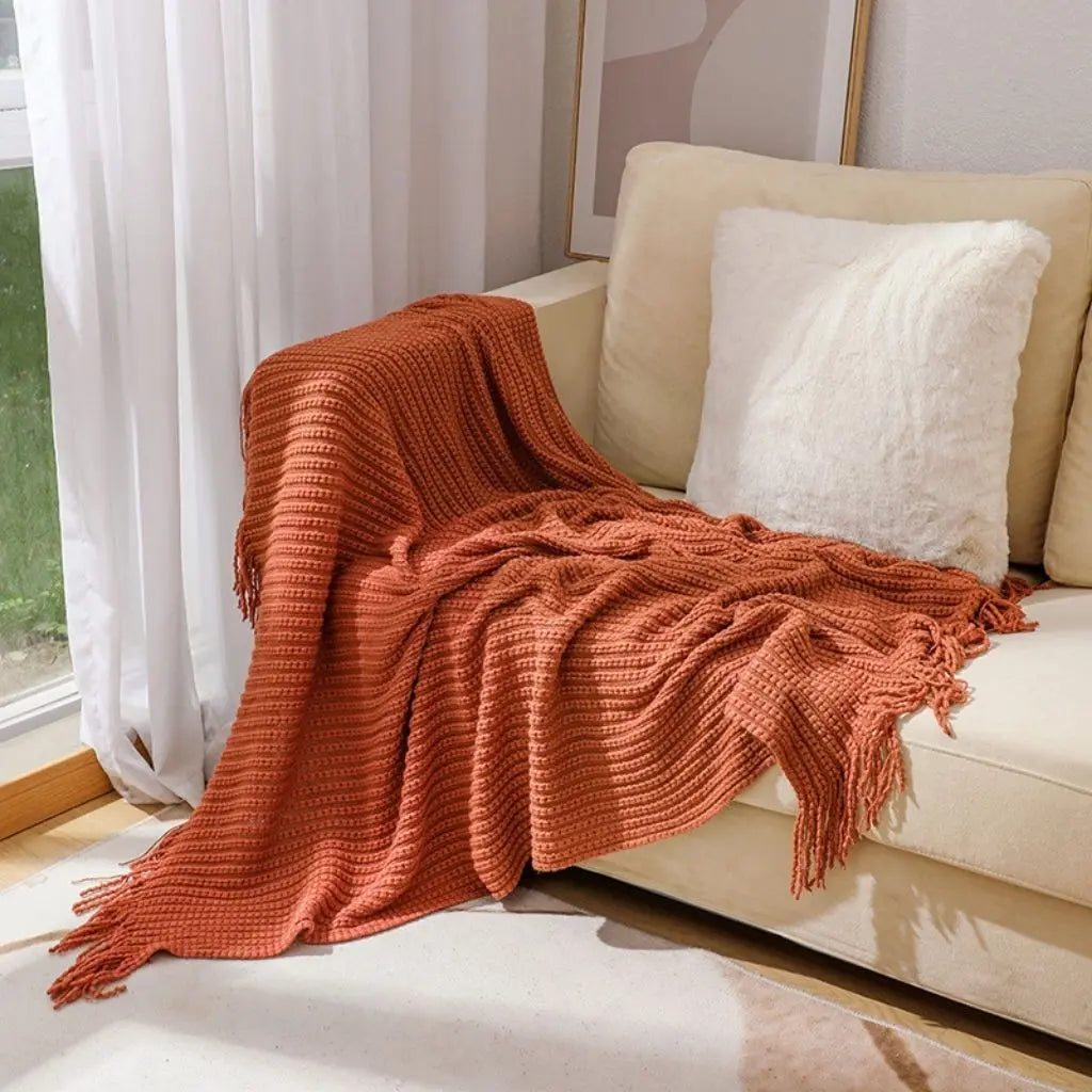 Textured chenille weave throw blanket featuring long fringe accents for added dimension