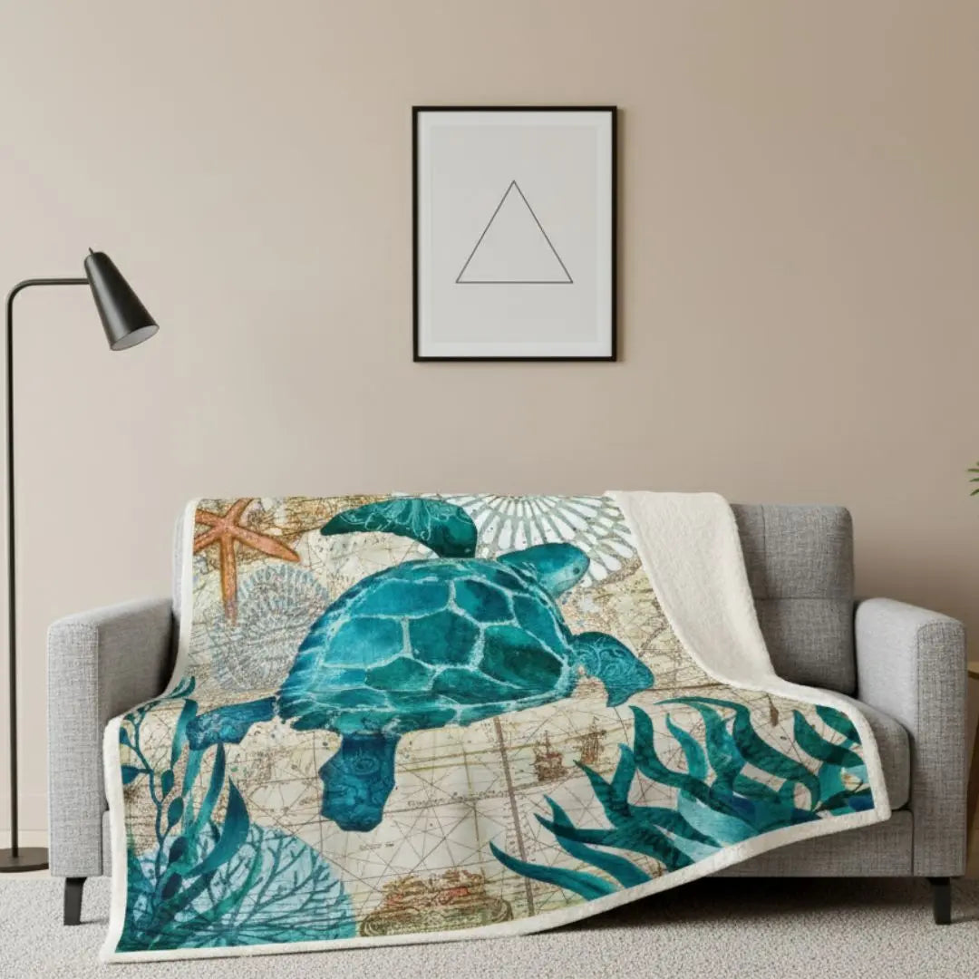 Thick coral fleece throw blanket featuring detailed coastal print design