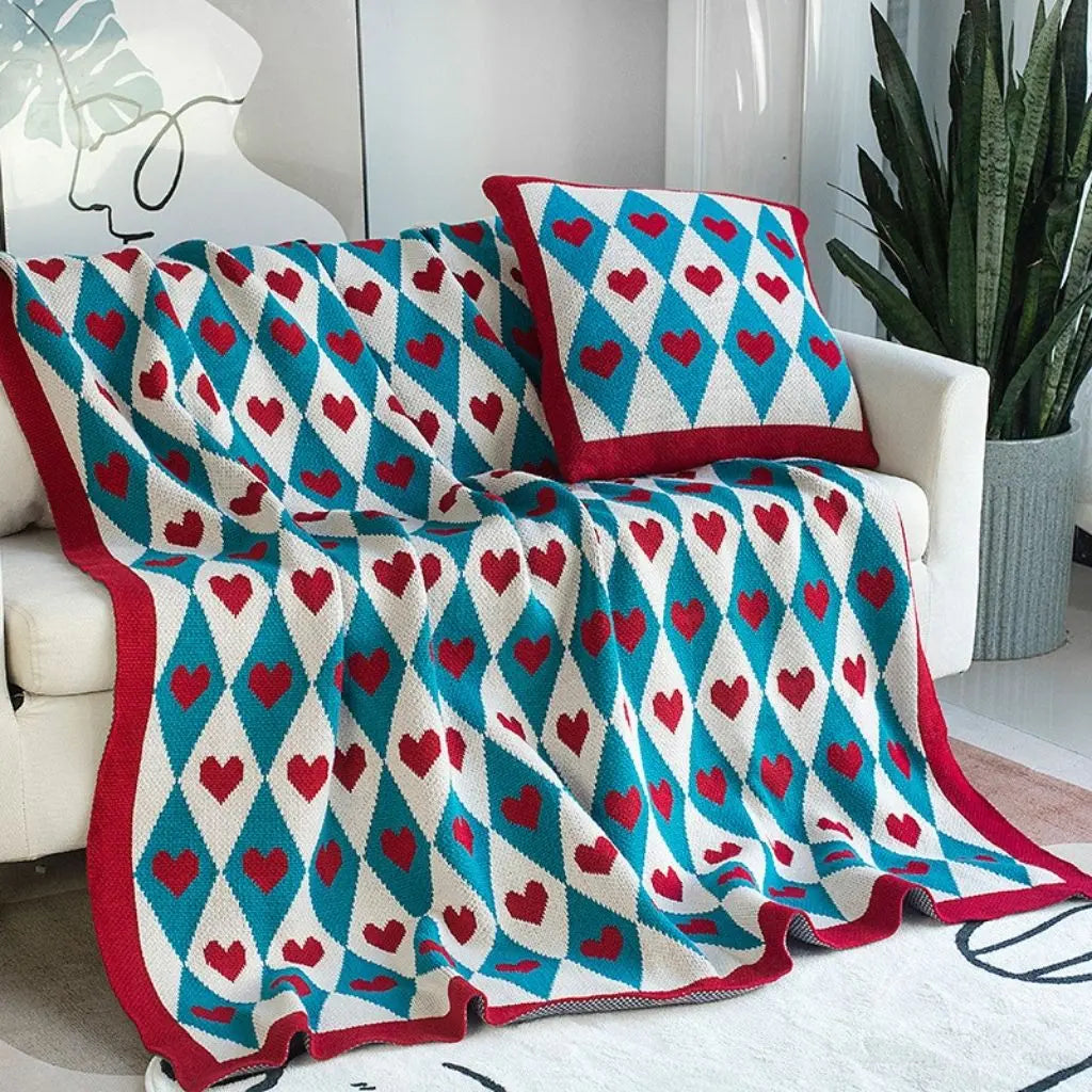 Geometric knit throw with contrasting patterns adding visual character to any space