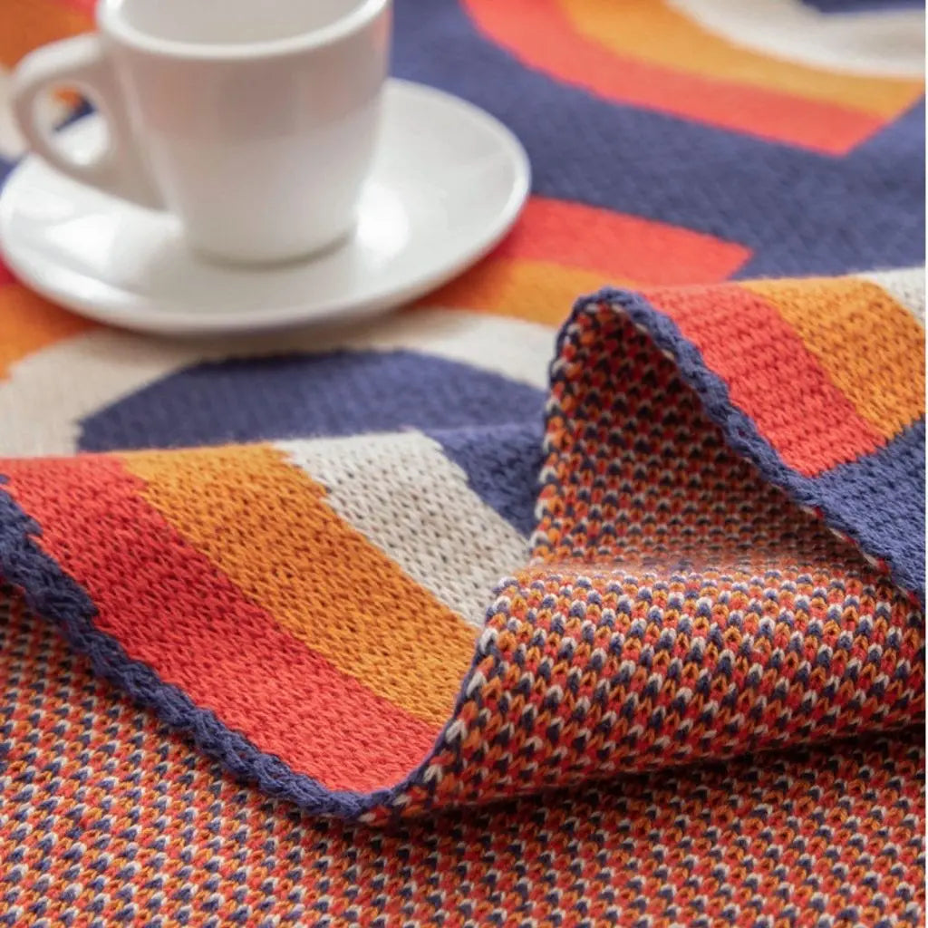 Cotton knit blanket with rainbow arch pattern perfect for bohemian home decorating