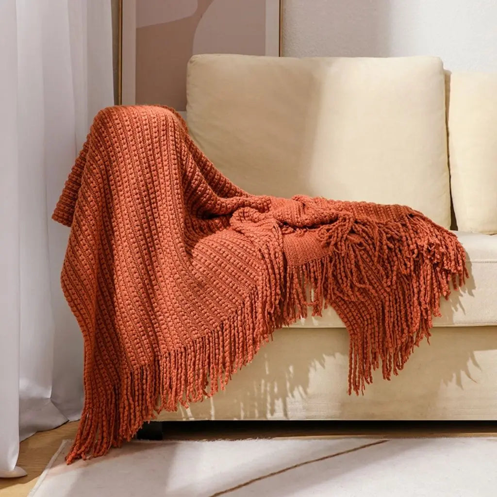 Lightweight acrylic chenille blanket with decorative fringe trim for year round comfort