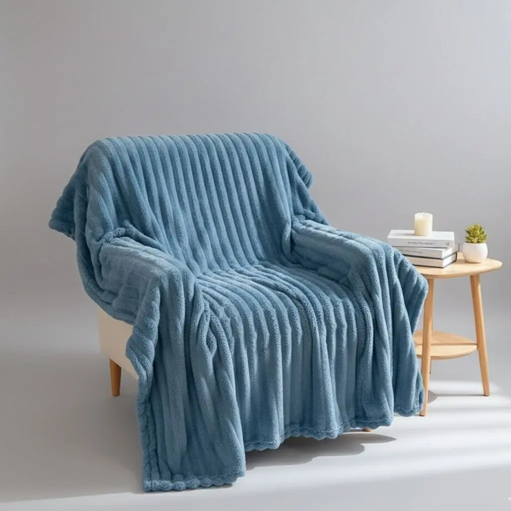 Soft polyester flannel throw with plush ribbed surface texture for bedroom use