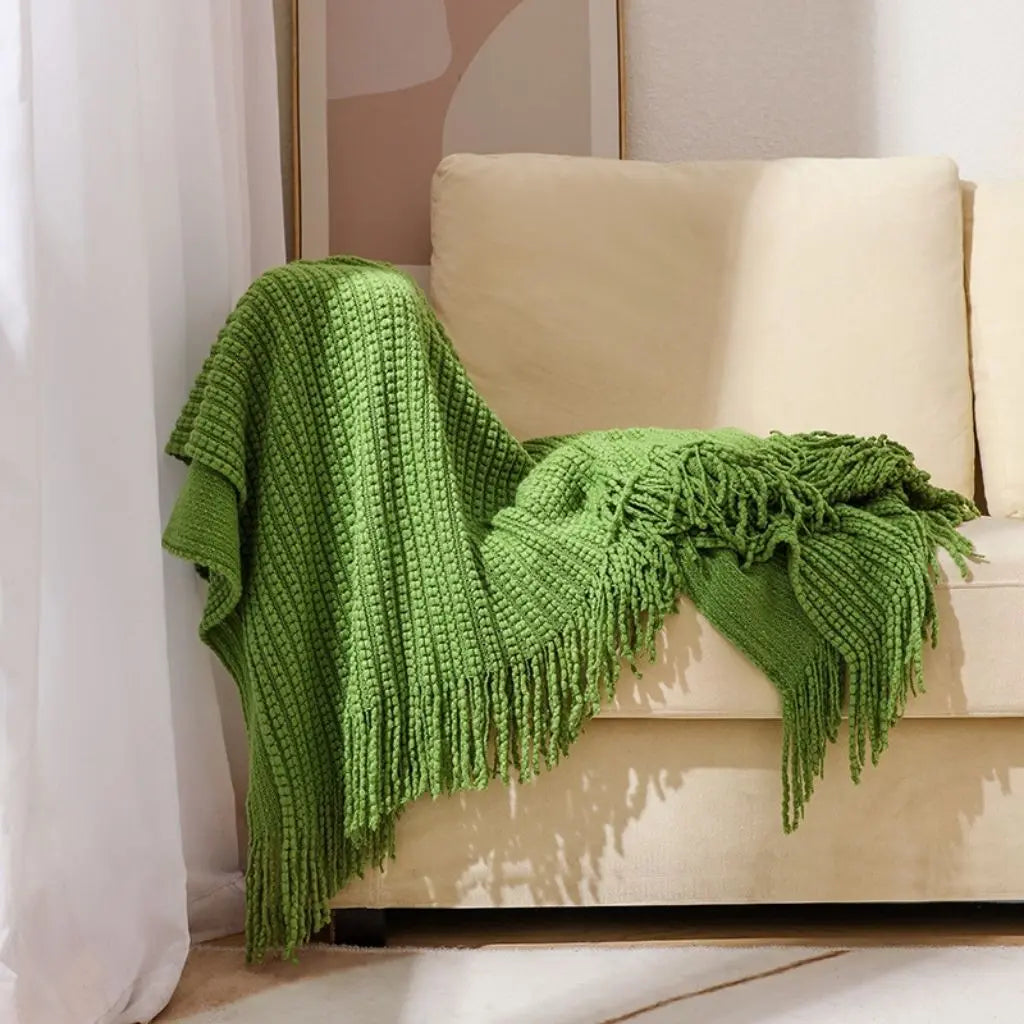 Solid color chenille throw with fringe detail ideal for home decorating and comfort