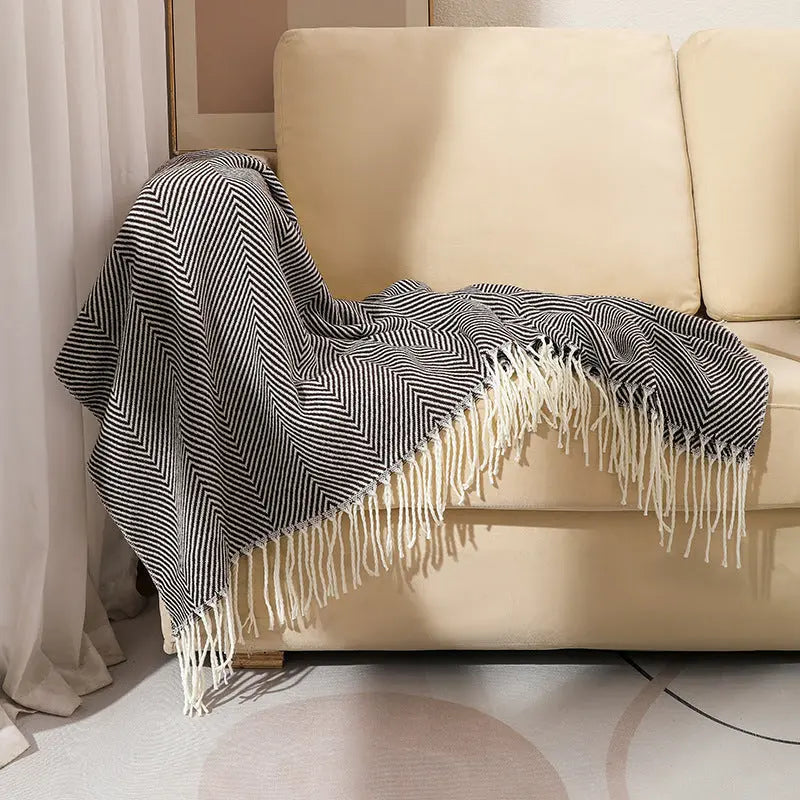Herringbone acrylic throw blanket with fringe edges for sofa and home decor in neutral tones