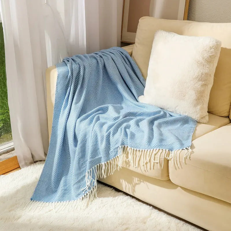 All season acrylic herringbone blanket with striped pattern and soft fringe detailing
