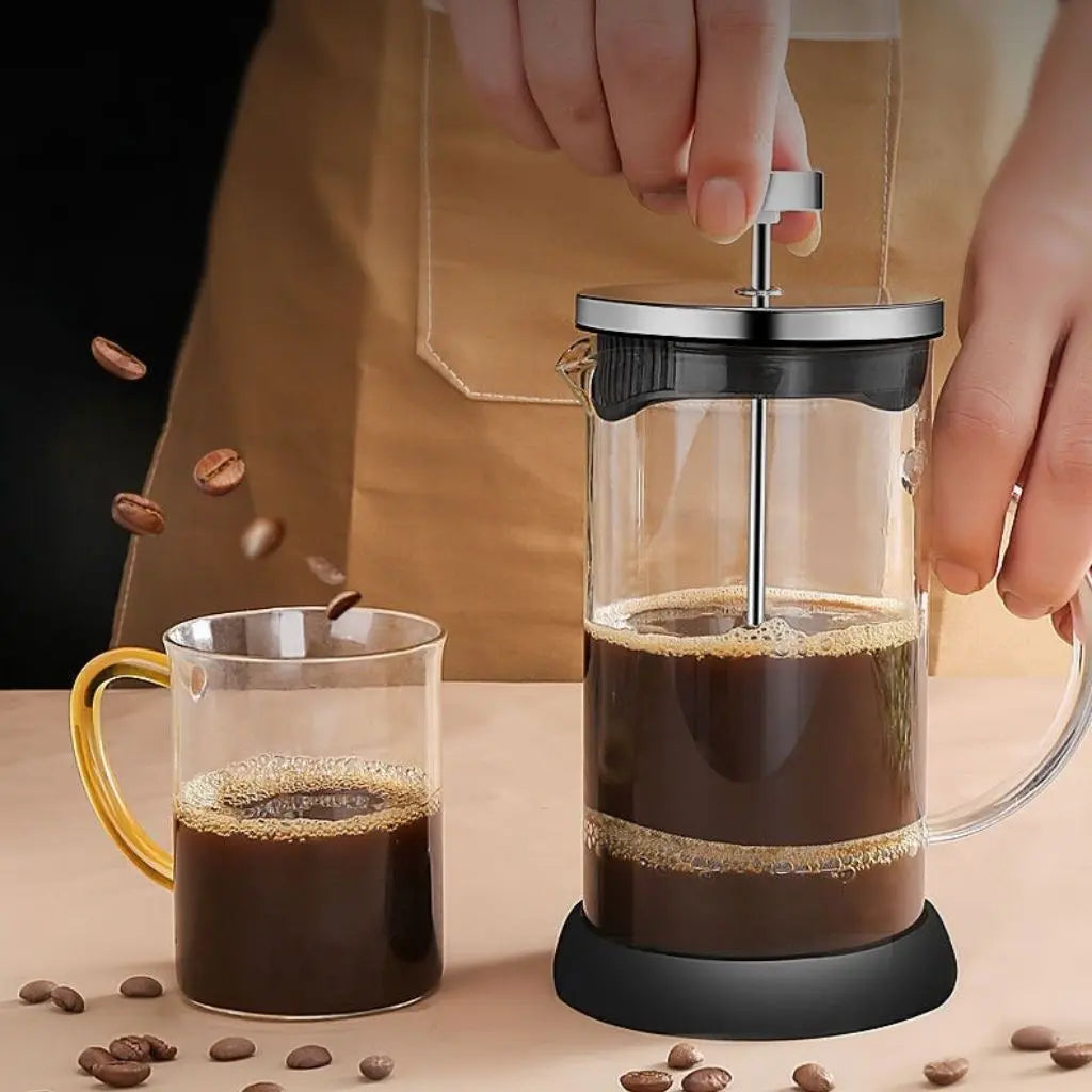 Easy-pour spout and ergonomic handle on glass french press for comfortable coffee serving