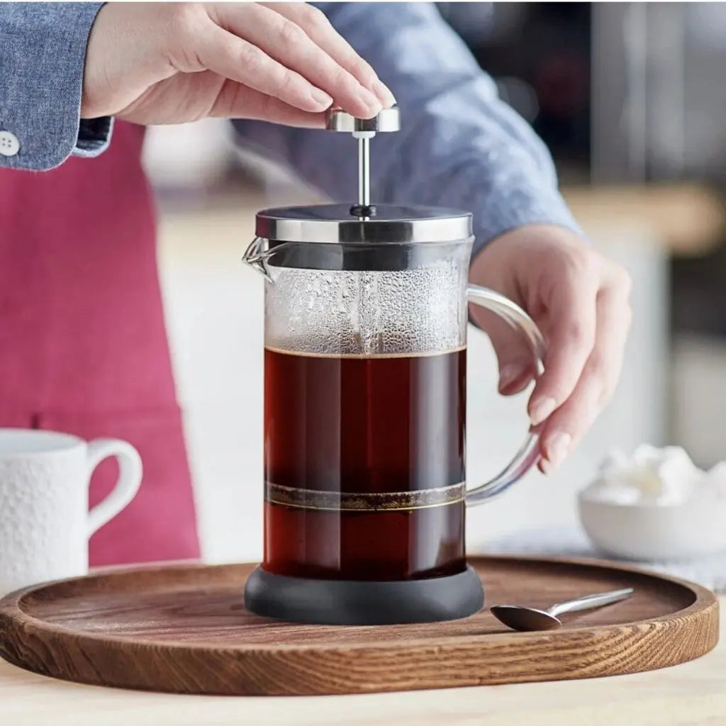 Versatile glass french press brewing aromatic flower tea with stainless steel filter system