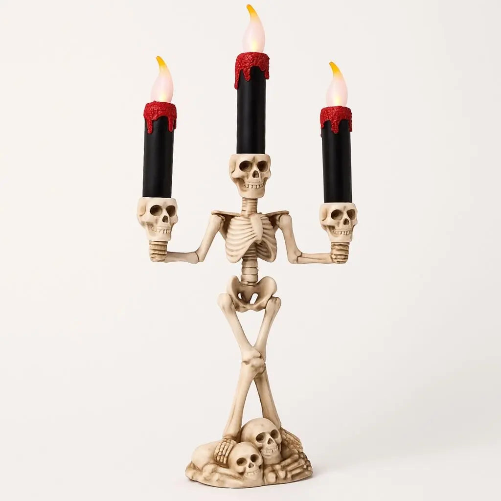 Metallic finish skeleton candle holder with LED lighting, ideal for Halloween party centerpieces