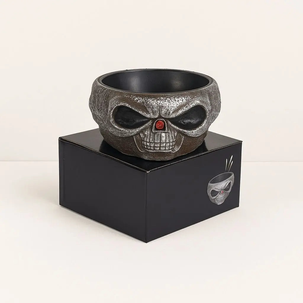Motion activated Halloween candy bowl with skeleton hand and glowing red eyes for spooky trick or treat fun