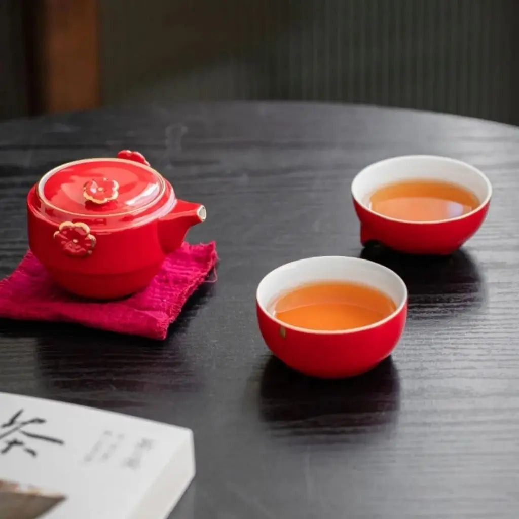 Ceramic travel tea set size comparison showing compact portable design for tea brewing on the go