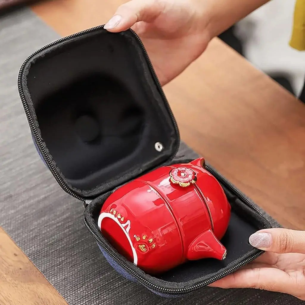 Complete ceramic travel tea set featuring fortune cat teapot and cups for portable gongfu tea brewing