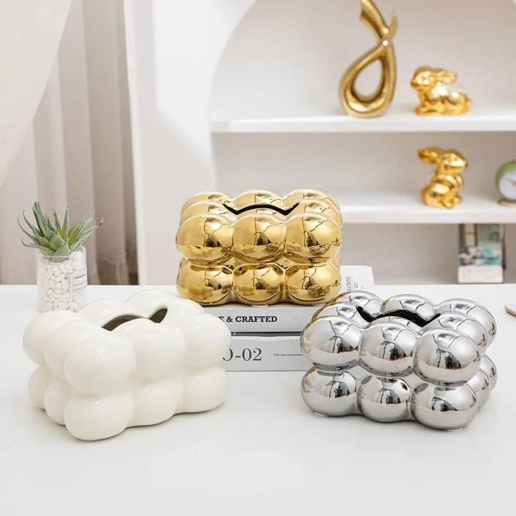 Artistic ceramic tissue box with bubble design combining functional storage with sculptural style