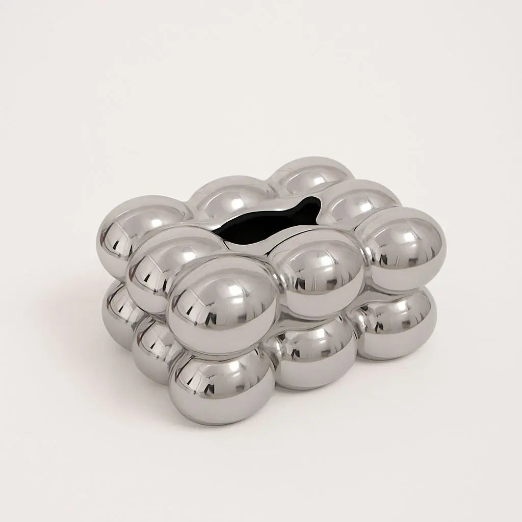 Compact ceramic tissue holder featuring decorative bubble design, ideal for bathroom counters