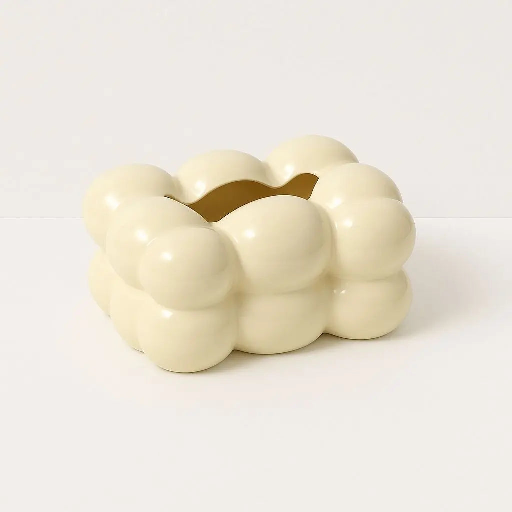 Close-up of sculptural ceramic tissue box showing detailed bubble texture and smooth finish