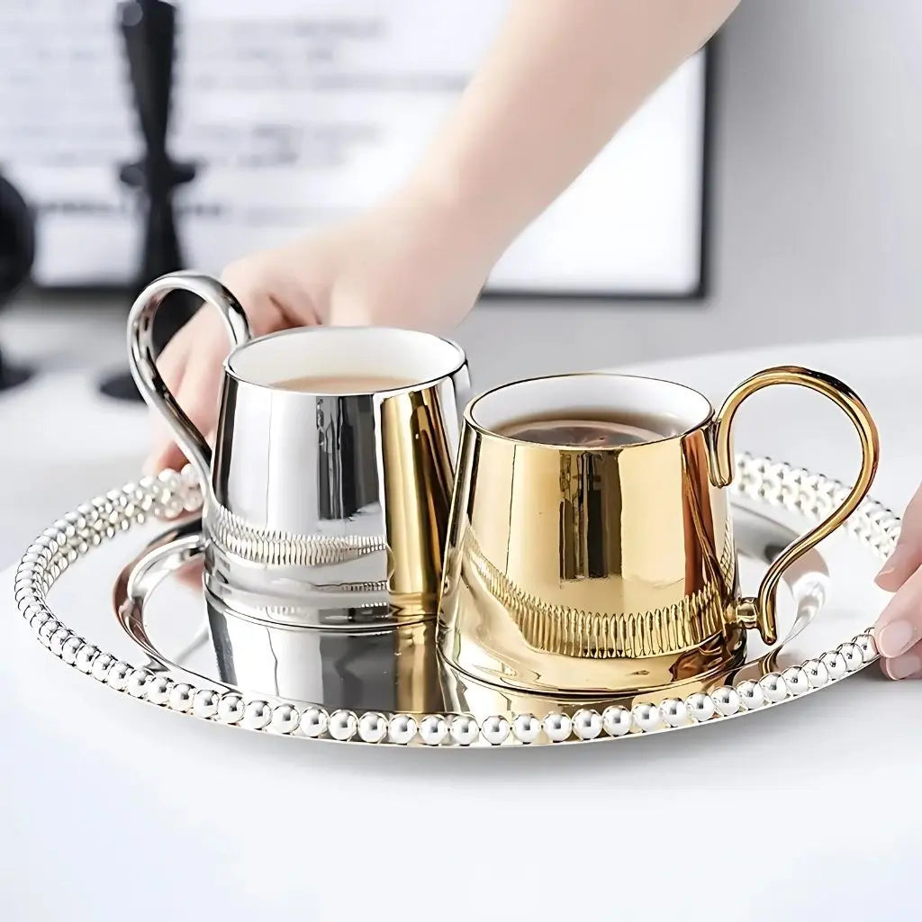 Reflective ceramic coffee mug with curved handle, modern electroplated finish, ideal for home use