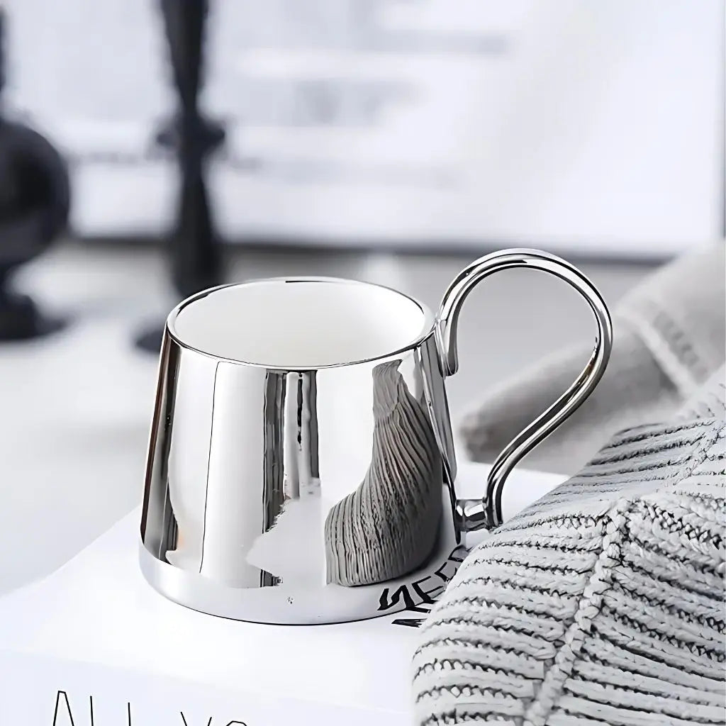 Sleek ceramic drinkware with metallic electroplated surface, 230ml capacity, perfect for beverages