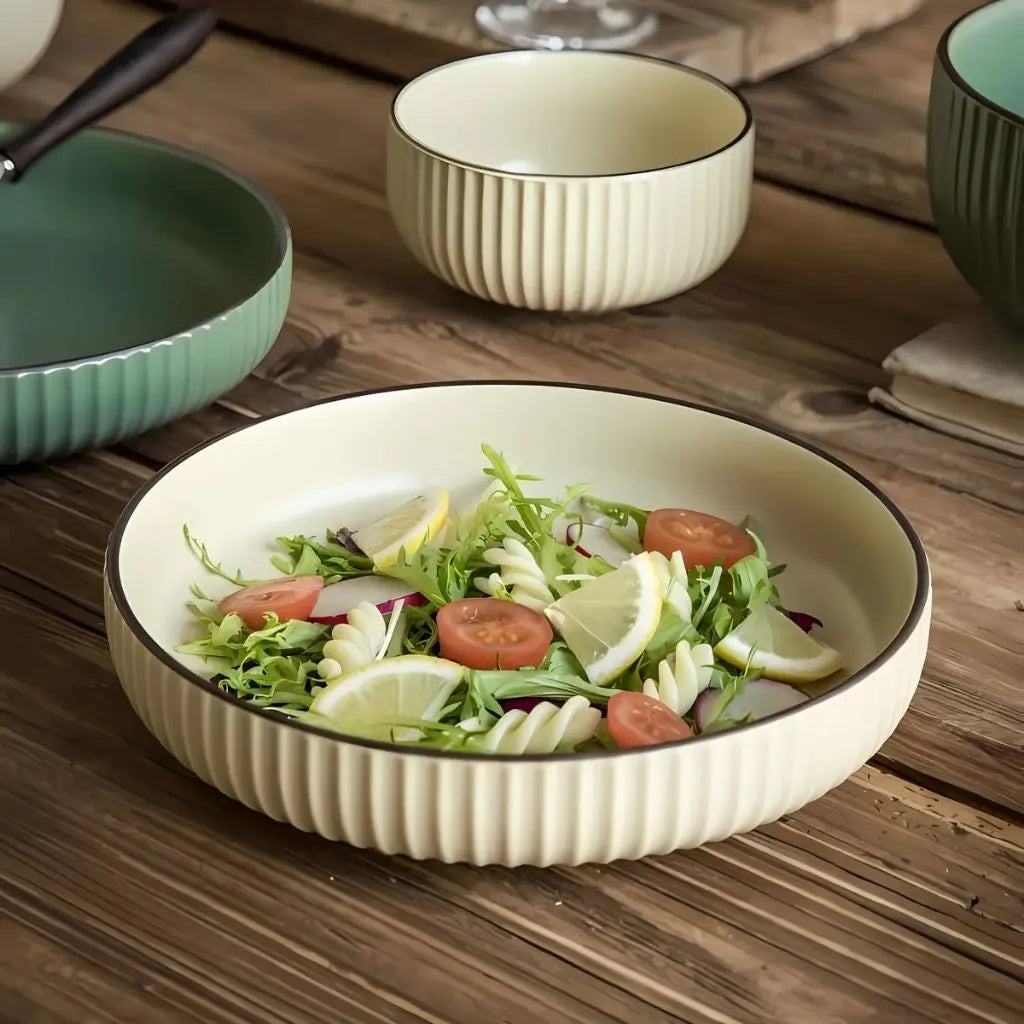 Nordic ceramic plate featuring striped textured edge and earthy glazed finish for table setting