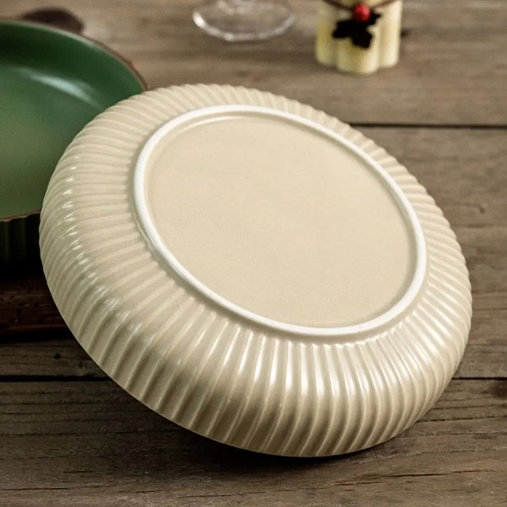 Retro inspired ceramic plate with hand applied glaze and textured edge for kitchen dining